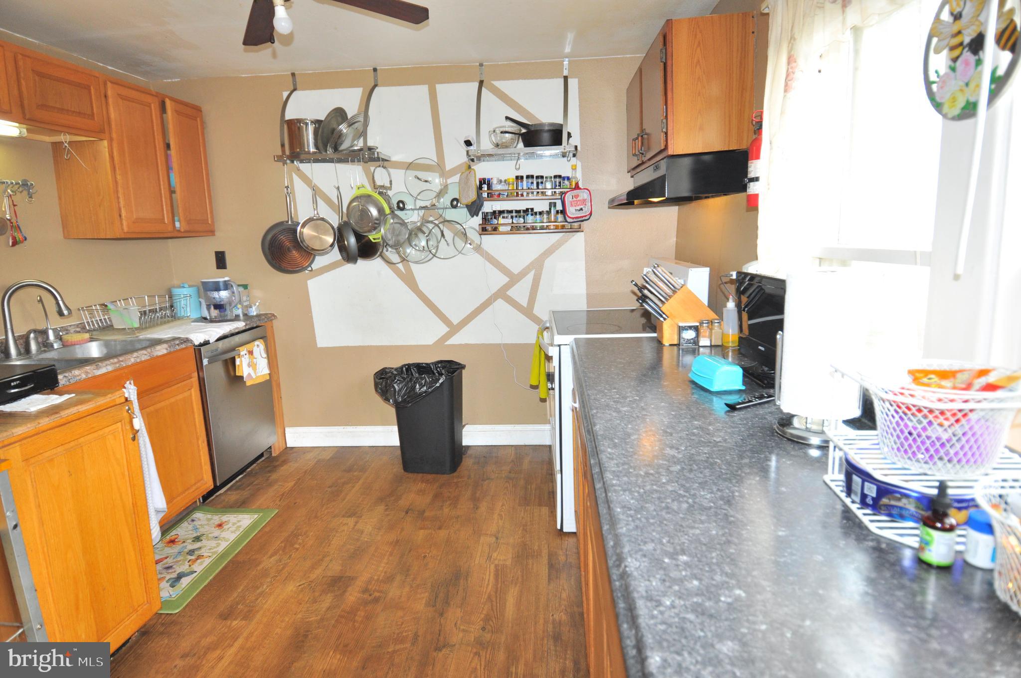 105 Front Street Pocomoke City, MD 21851 - Photo 13 of 50 a view of living room with furniture and wooden floor