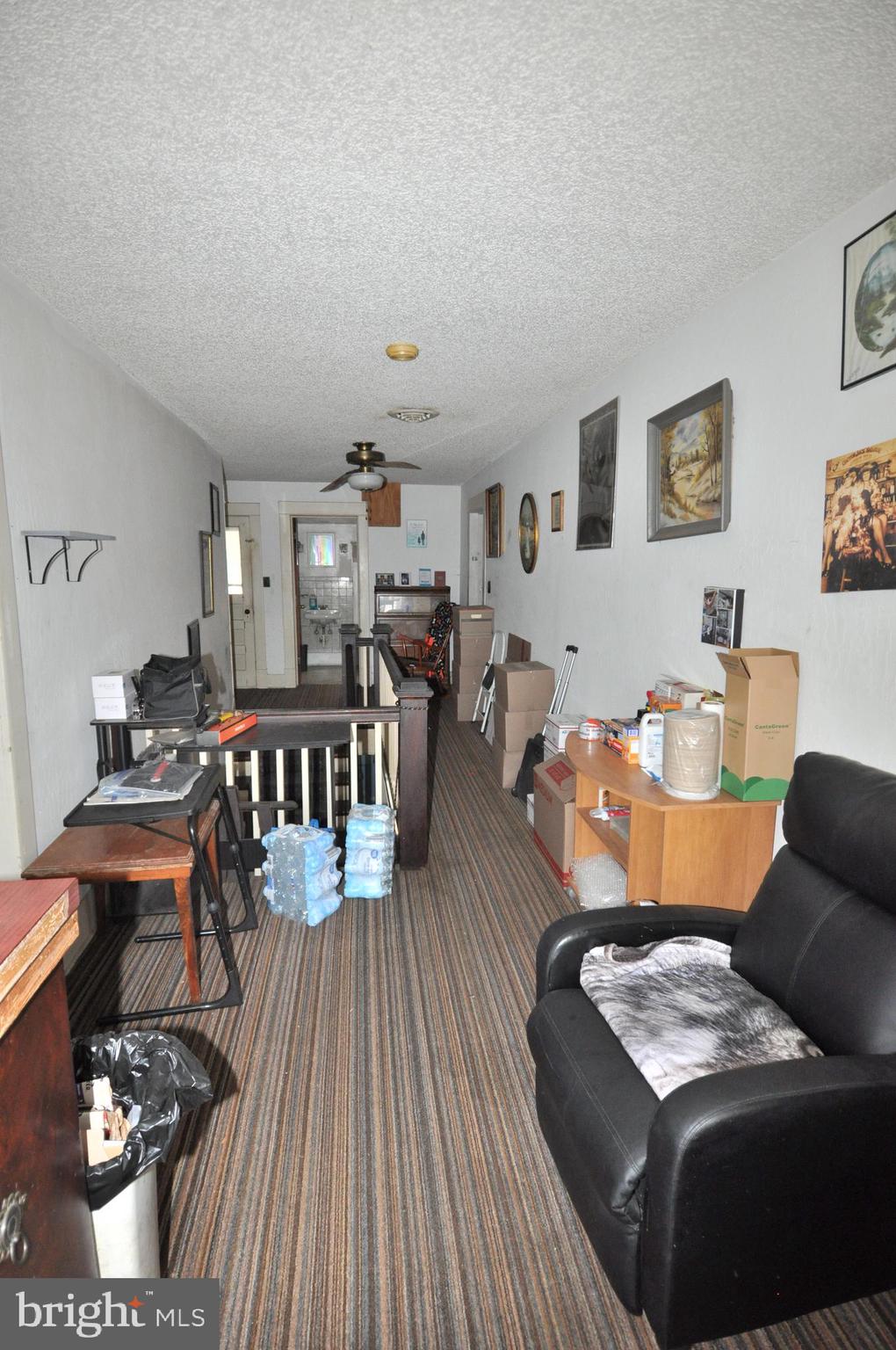 105 Front Street Pocomoke City, MD 21851 - Photo 20 of 50 a living room with furniture and wooden floor