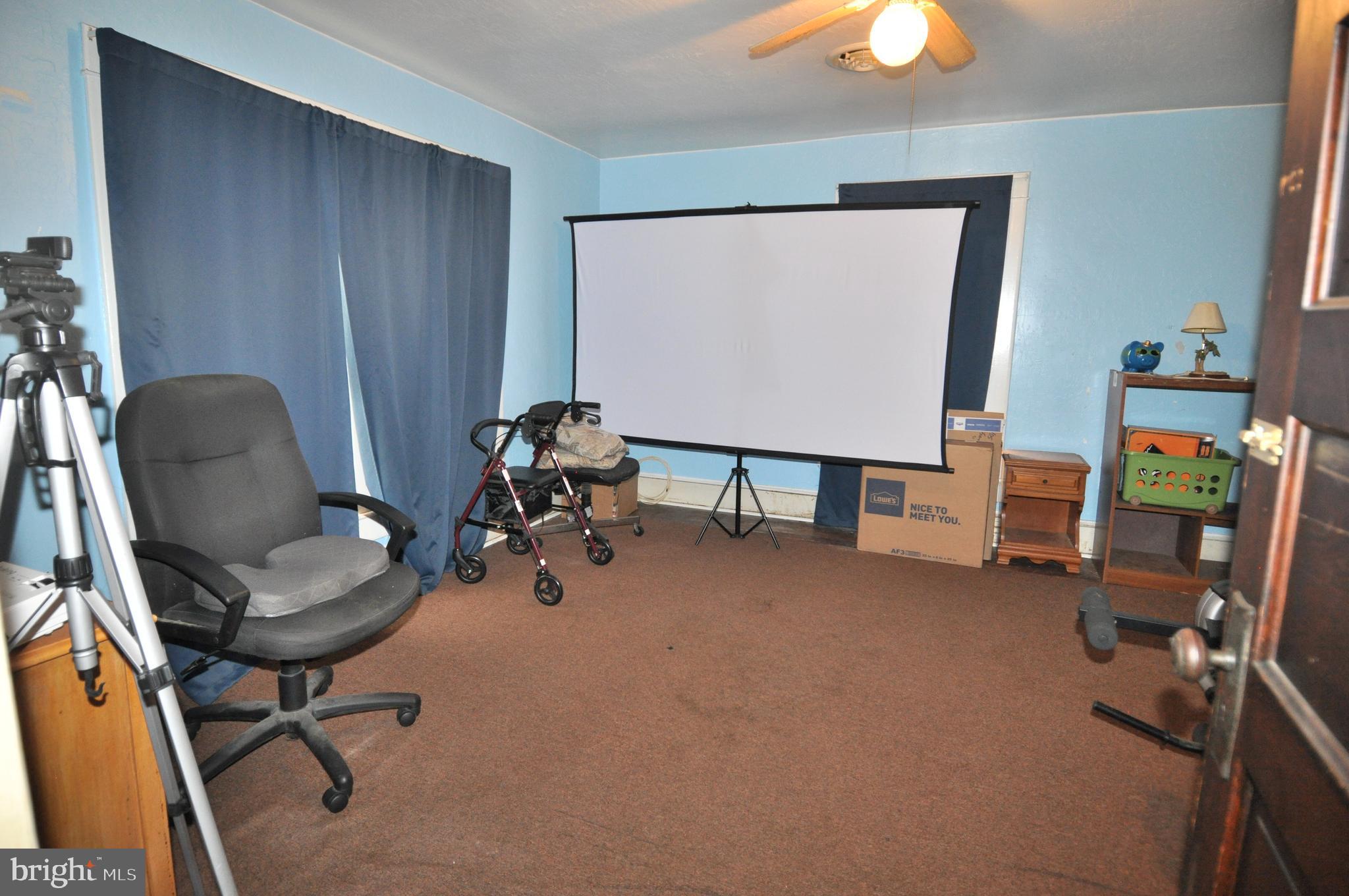 105 Front Street Pocomoke City, MD 21851 - Photo 24 of 50 a view of a workspace with furniture and a window