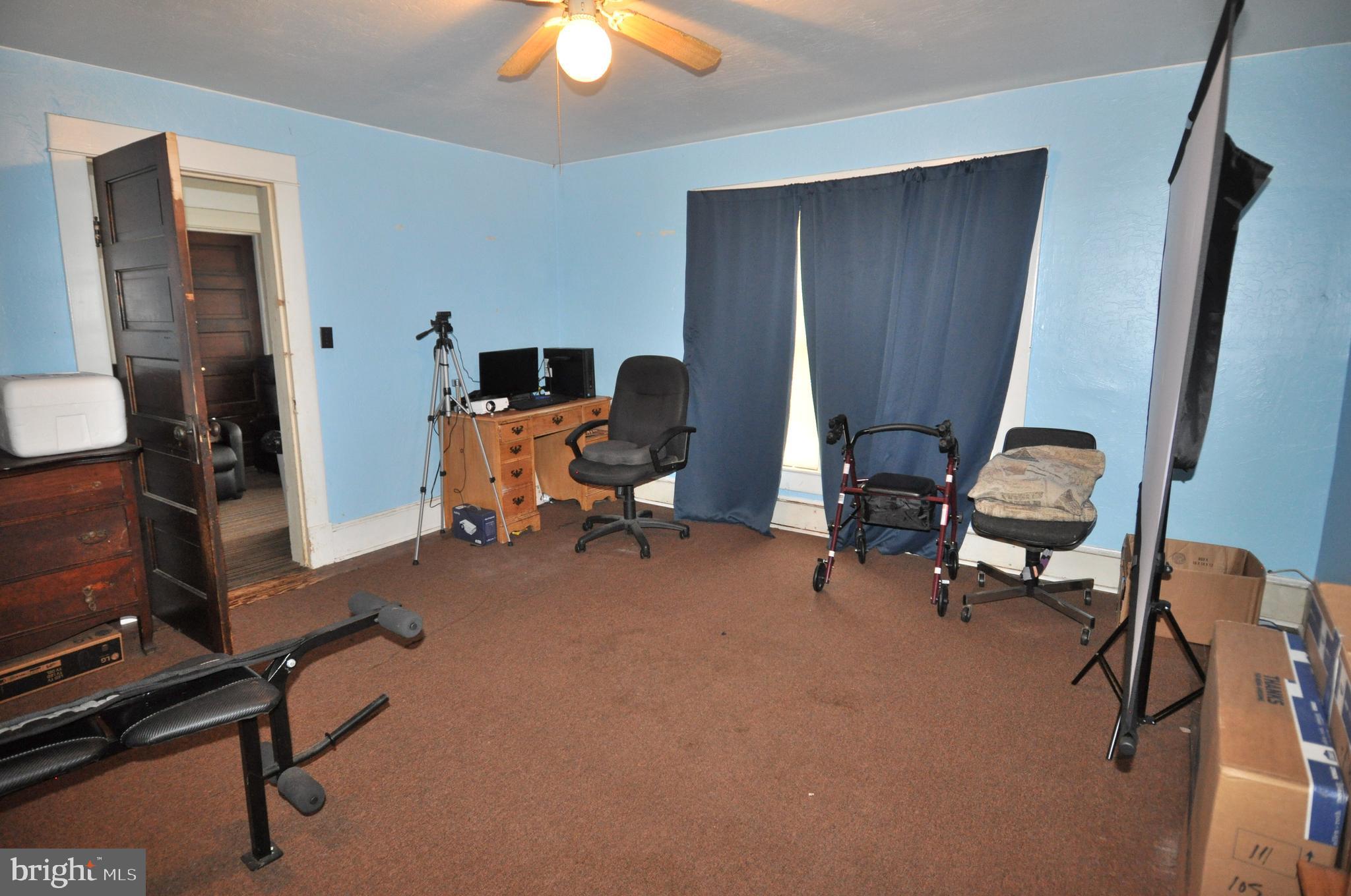 105 Front Street Pocomoke City, MD 21851 - Photo 25 of 50 a view of a workspace with furniture and a window