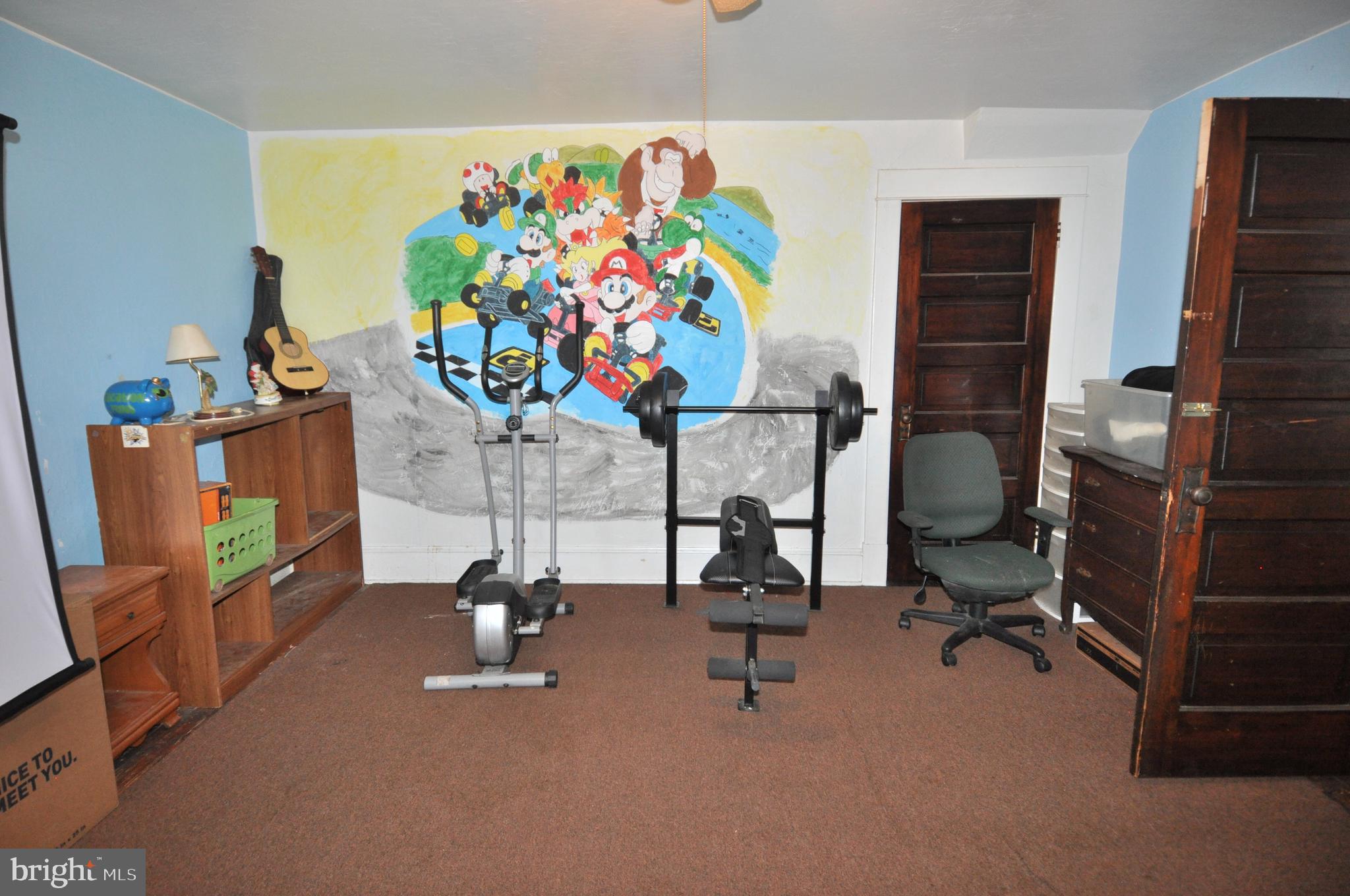 105 Front Street Pocomoke City, MD 21851 - Photo 26 of 50 a view of a workspace with gym equipment