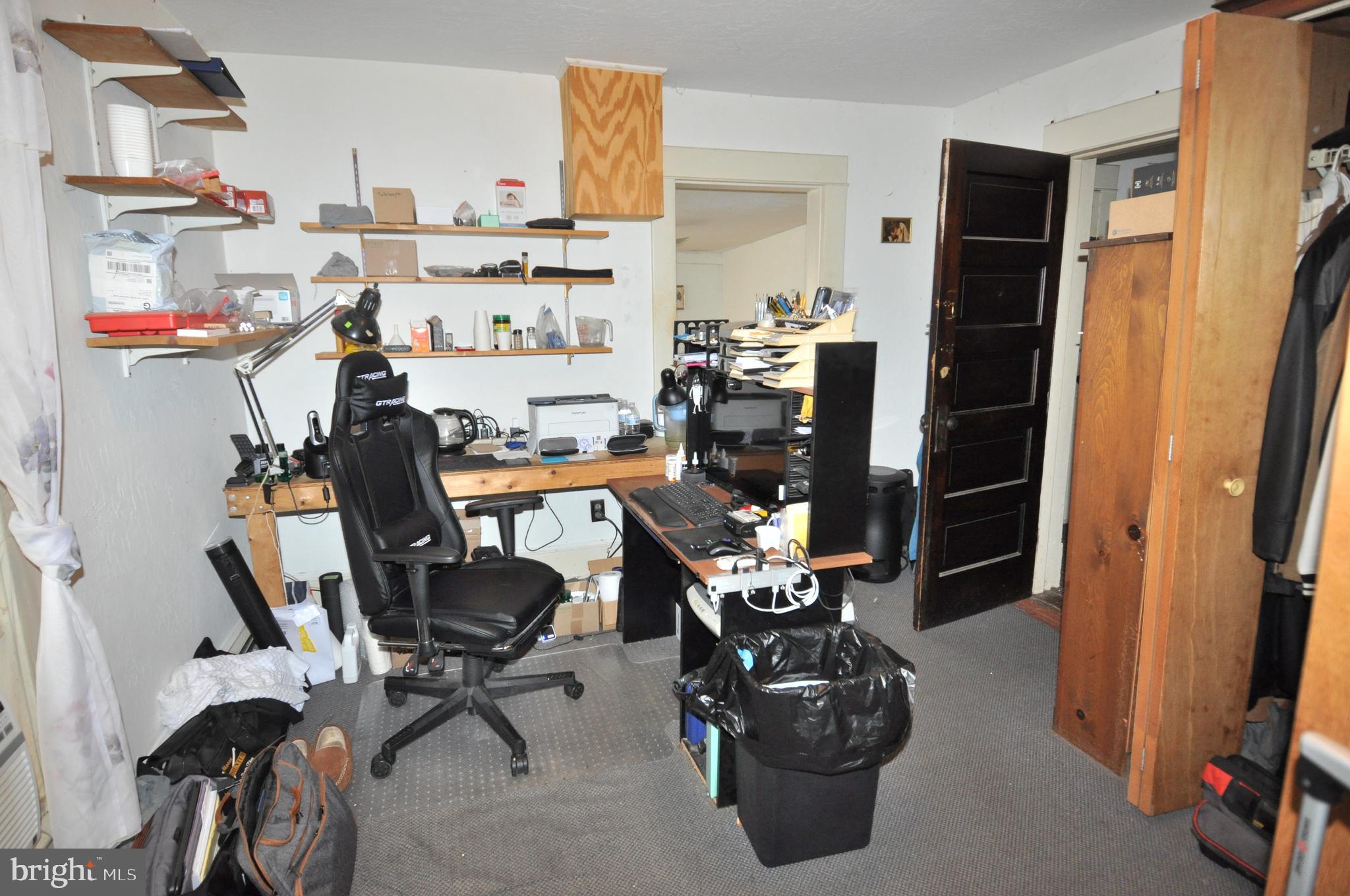105 Front Street Pocomoke City, MD 21851 - Photo 27 of 50 a room with furniture a washer and dryer