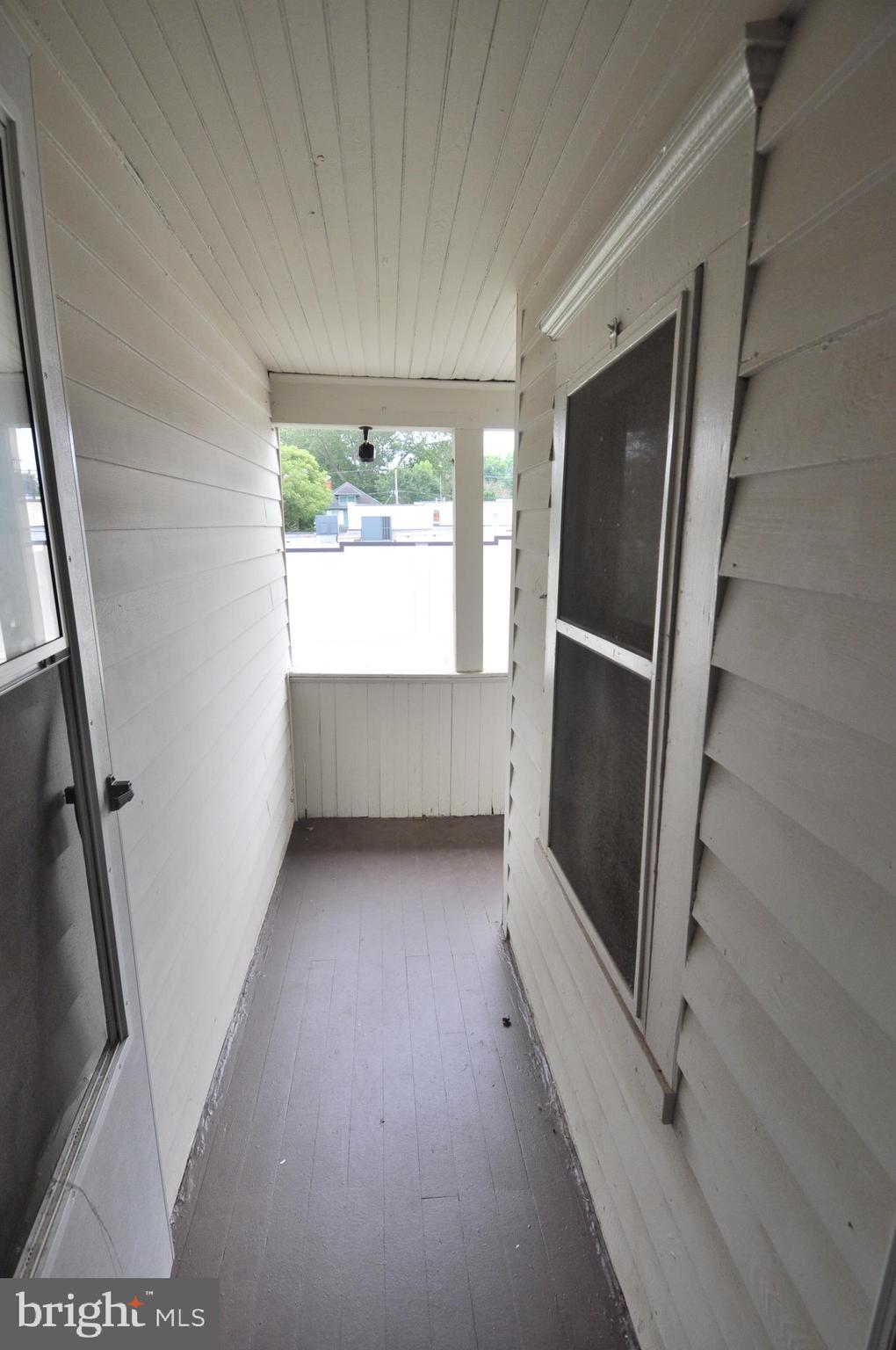105 Front Street Pocomoke City, MD 21851 - Photo 28 of 50 a view of an empty room with a window