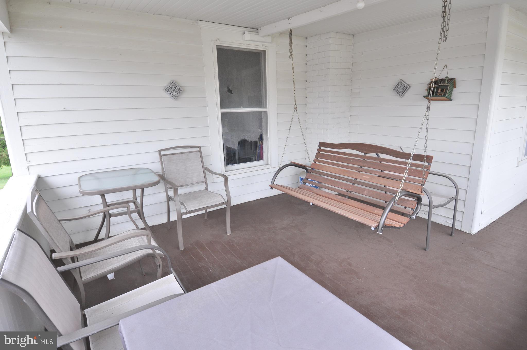 105 Front Street Pocomoke City, MD 21851 - Photo 31 of 50 a bedroom with furniture and a rug