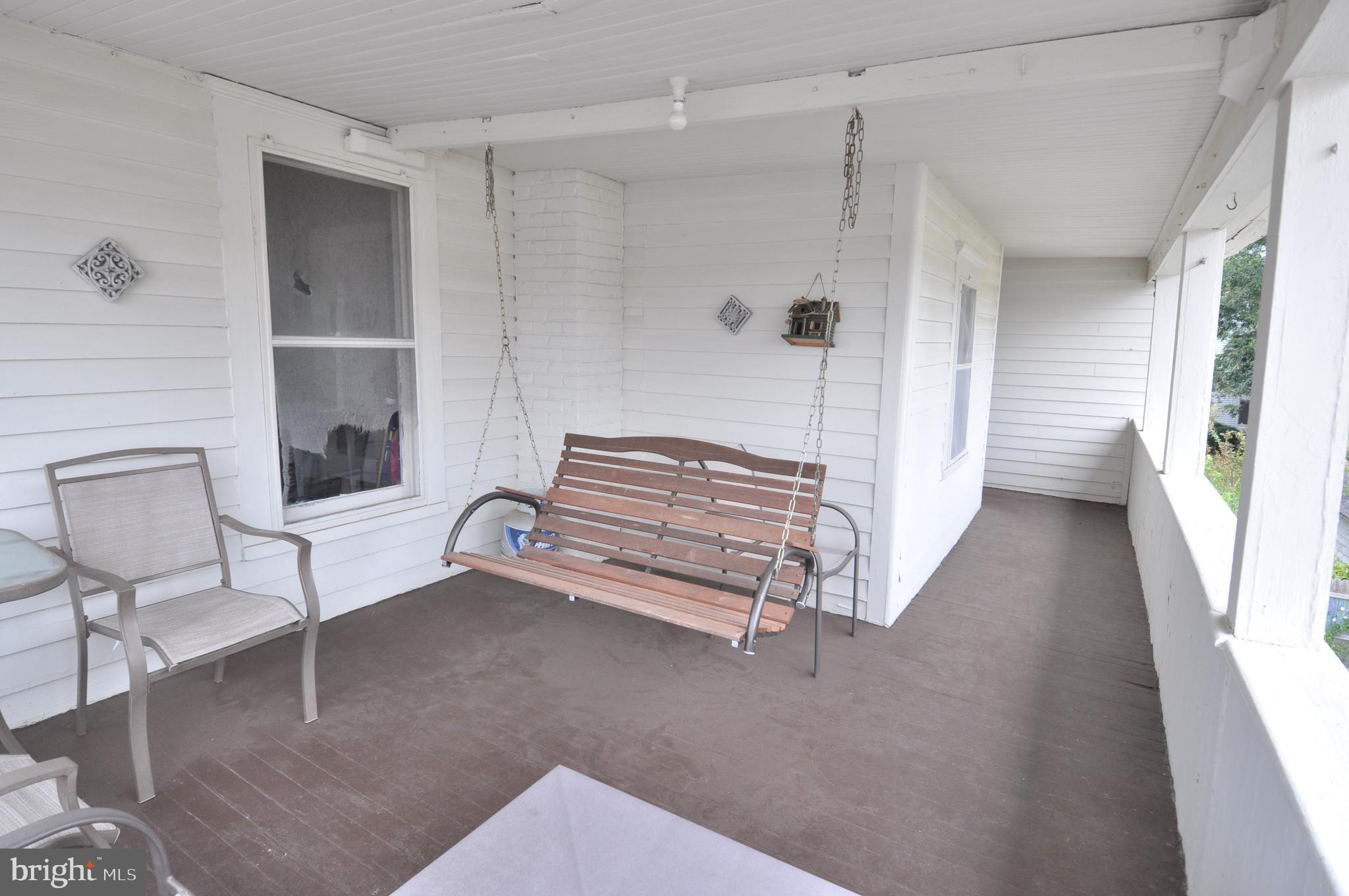105 Front Street Pocomoke City, MD 21851 - Photo 32 of 50 a view of a livingroom with a staircase