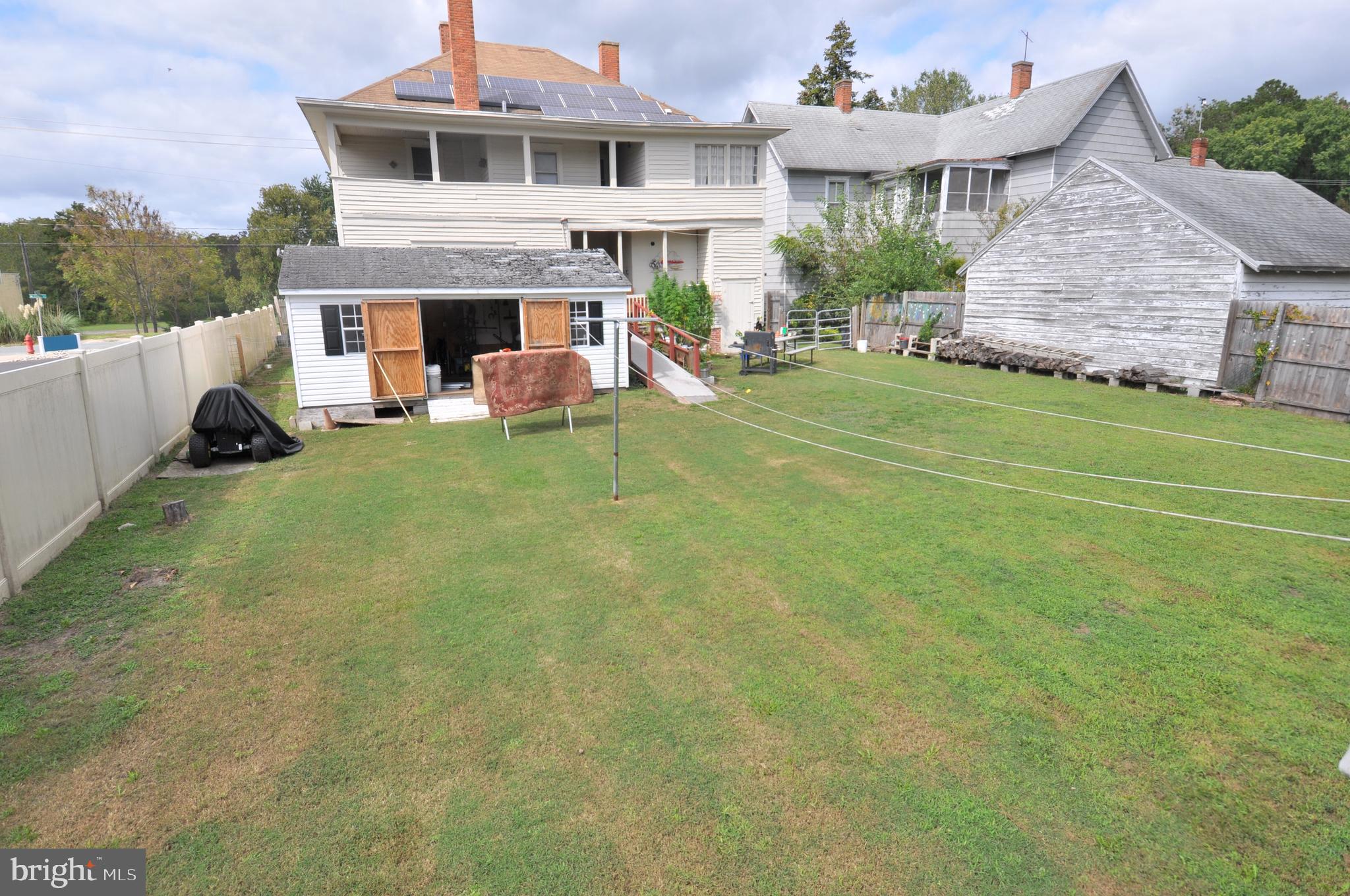105 Front Street Pocomoke City, MD 21851 - Photo 35 of 50 a view of a house with a yard and sitting area