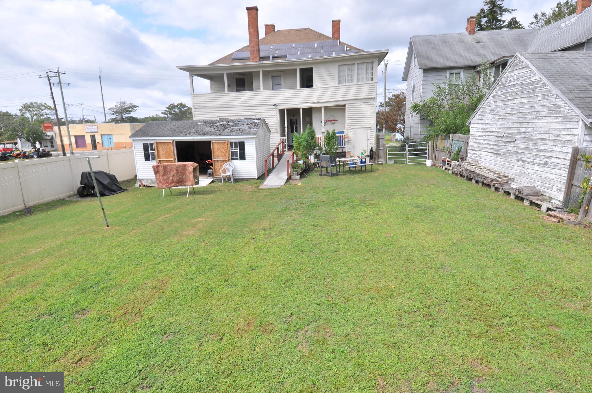 105 Front Street Pocomoke City, MD 21851 - Photo 36 of 50 a front view of a house with garden