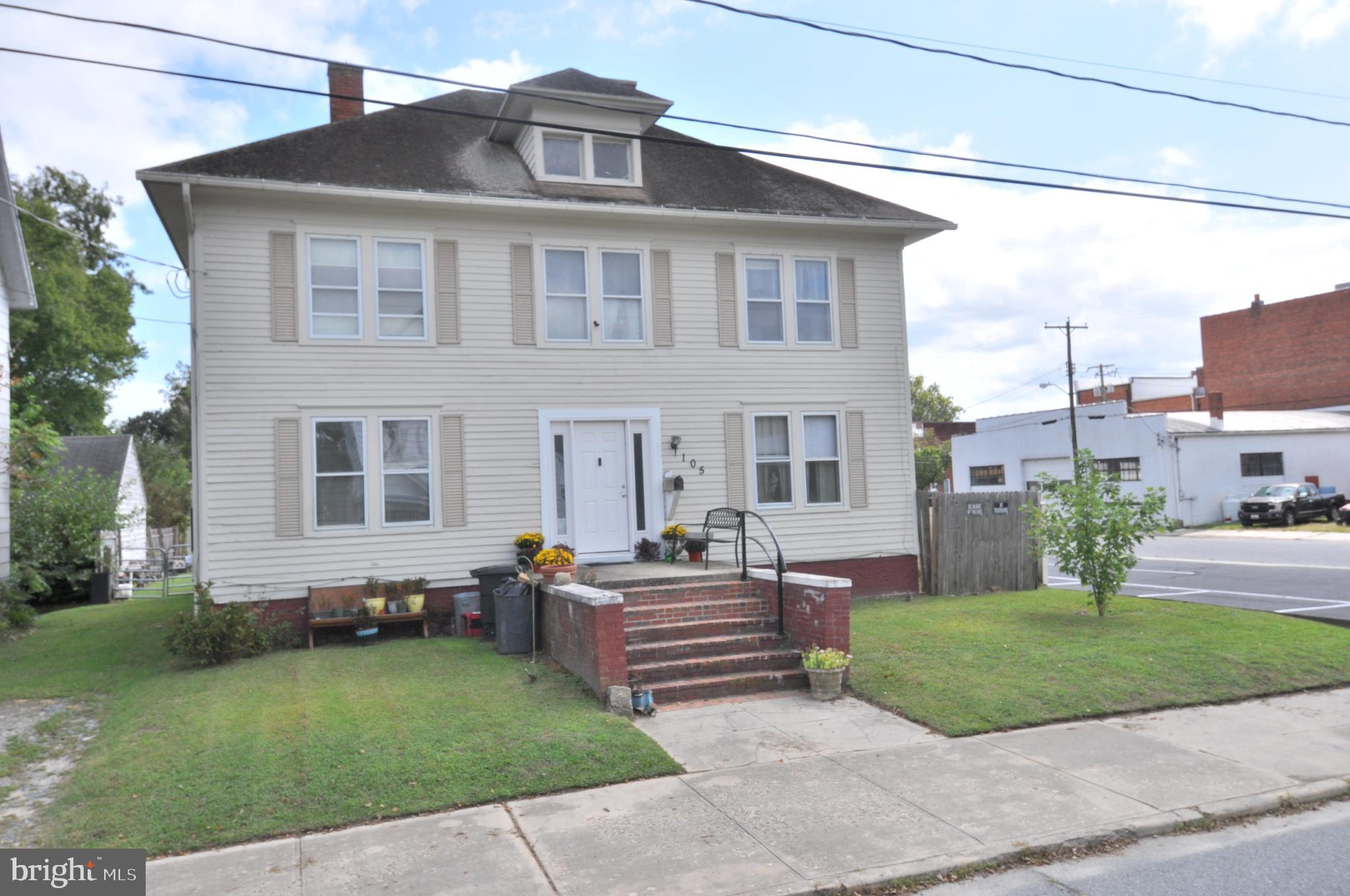 105 Front Street Pocomoke City, MD 21851 - Photo 40 of 50 a front view of a house with a garden