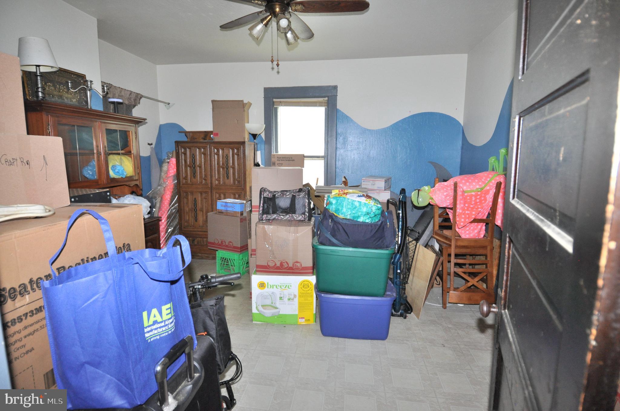 105 Front Street Pocomoke City, MD 21851 - Photo 43 of 50 a living room with furniture and appliances