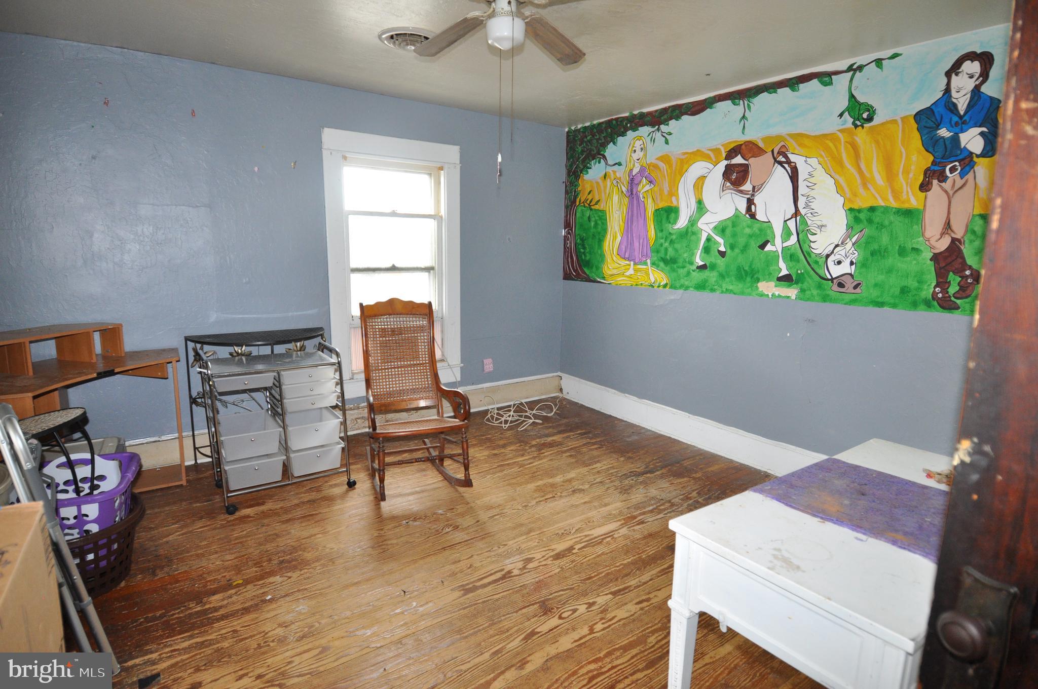 105 Front Street Pocomoke City, MD 21851 - Photo 44 of 50 a living room with furniture and a wooden floor