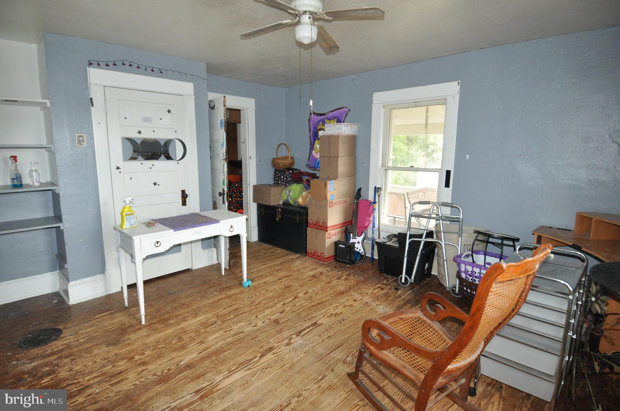 105 Front Street Pocomoke City, MD 21851 - Photo 45 of 50 a living room with furniture a flat screen tv and a window
