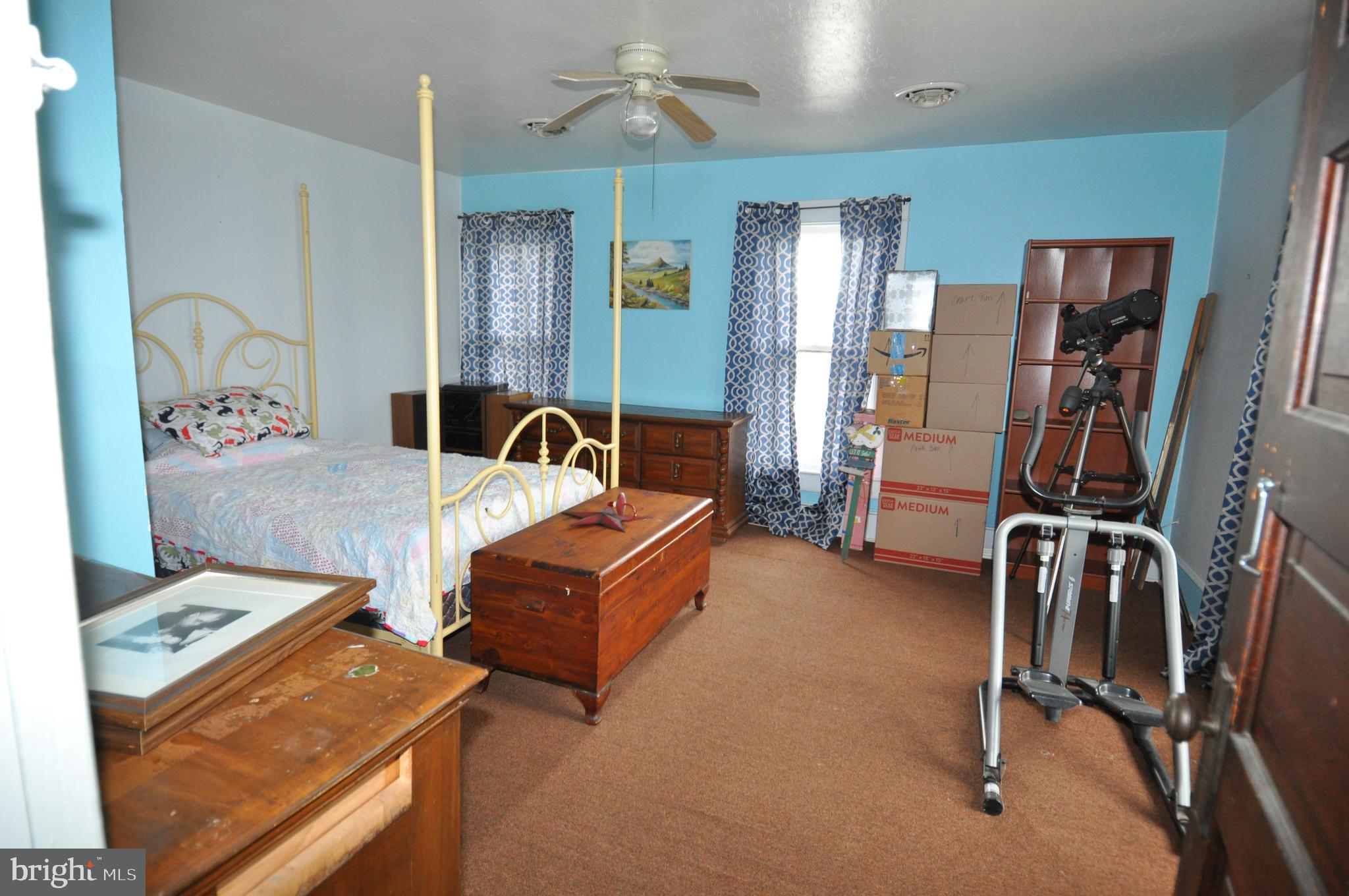 105 Front Street Pocomoke City, MD 21851 - Photo 46 of 50 a bedroom with furniture and a flat screen tv