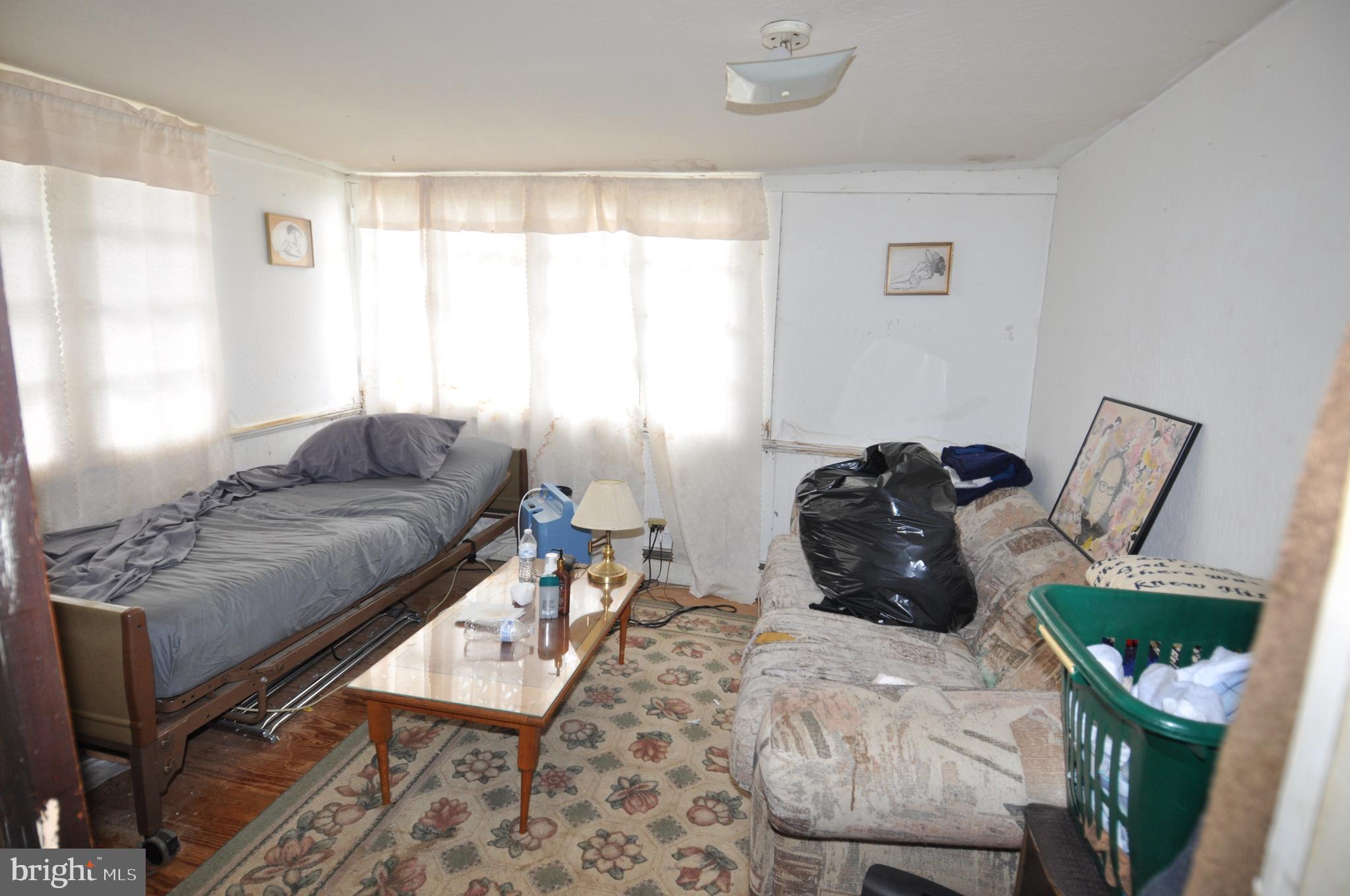 105 Front Street Pocomoke City, MD 21851 - Photo 47 of 50 a living room with furniture and a window