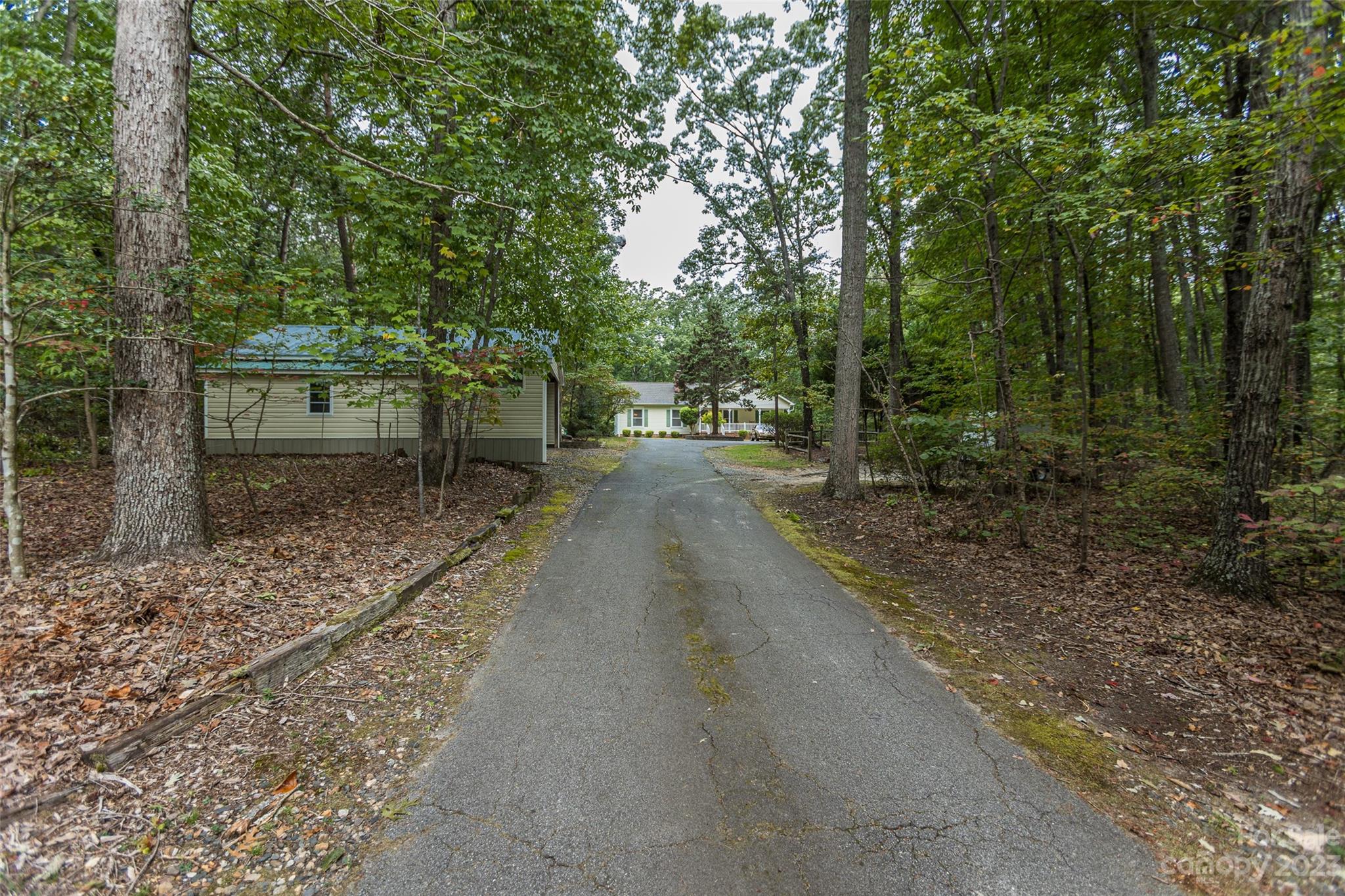 256 Georgewoods Drive Dallas, NC 28034 - Photo 2 of 45 a view of a yard with plants and trees beside of it