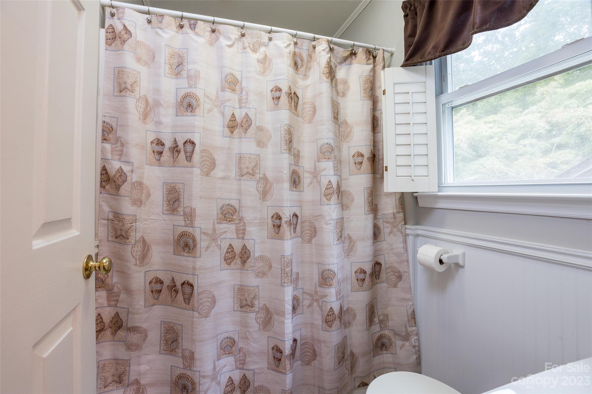 256 Georgewoods Drive Dallas, NC 28034 - Photo 21 of 45 a bathroom with a shower curtain and a window
