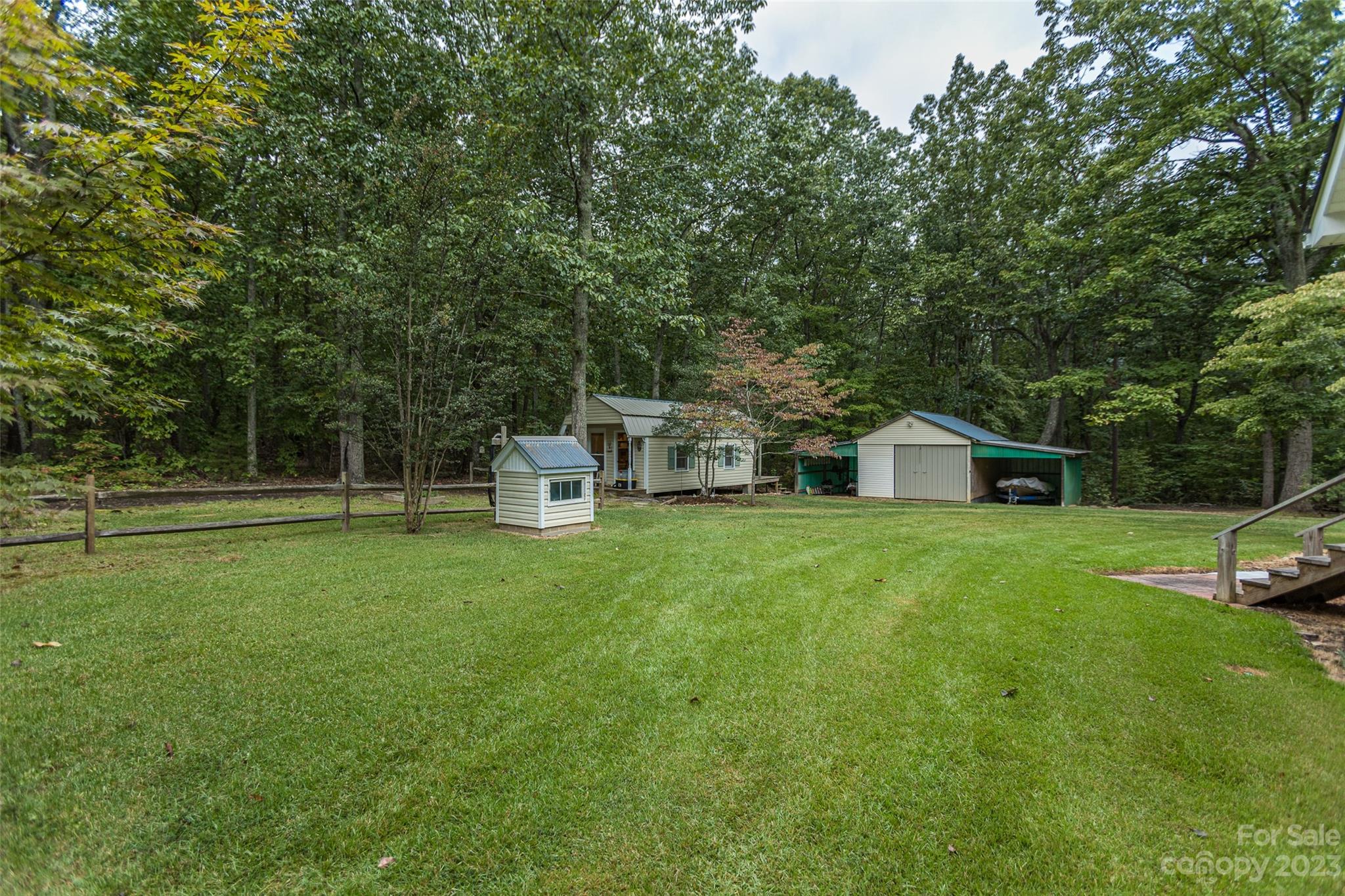 256 Georgewoods Drive Dallas, NC 28034 - Photo 35 of 45 a view of a house with a yard