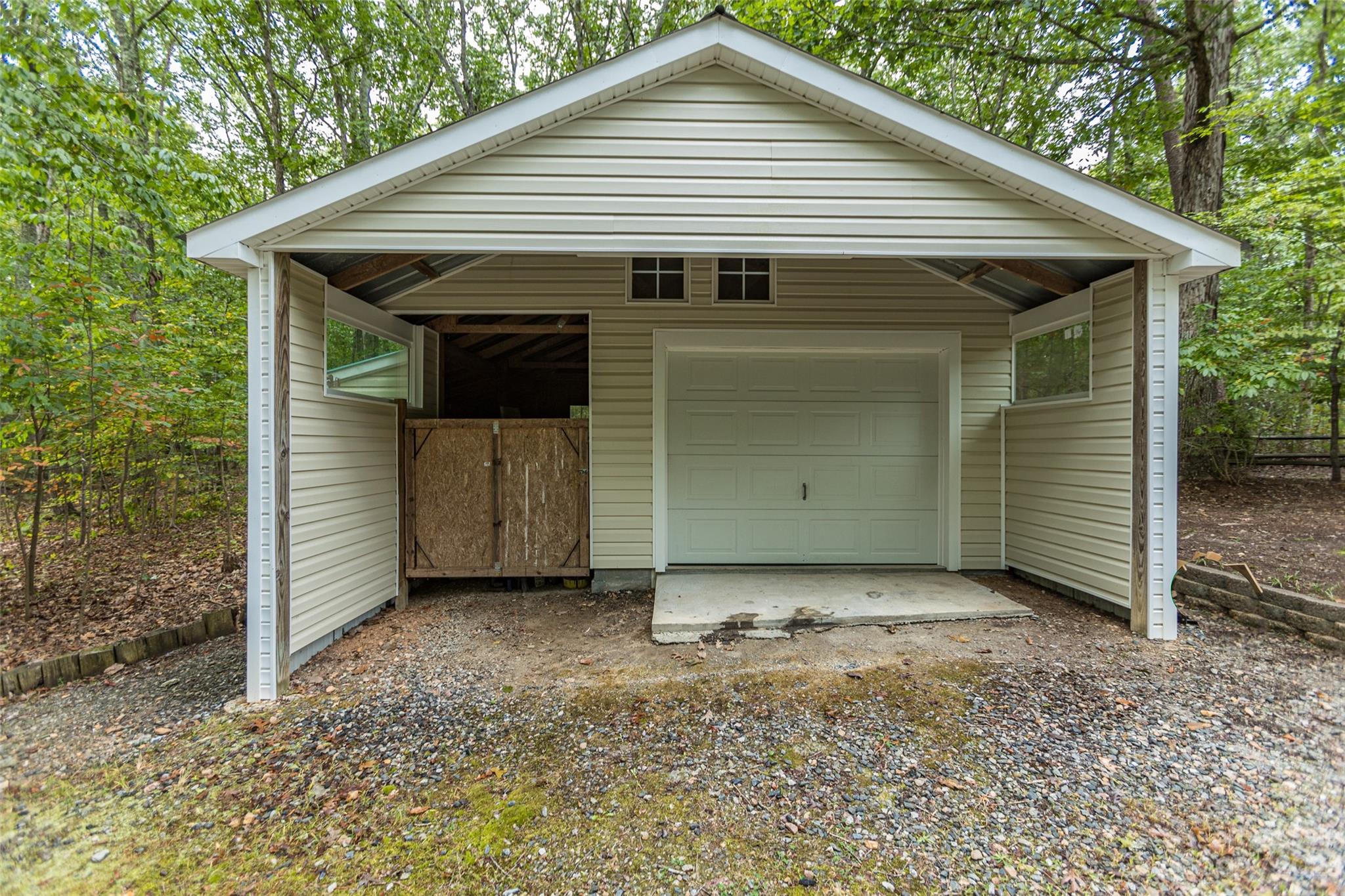 256 Georgewoods Drive Dallas, NC 28034 - Photo 37 of 45 a view of a small house with garage