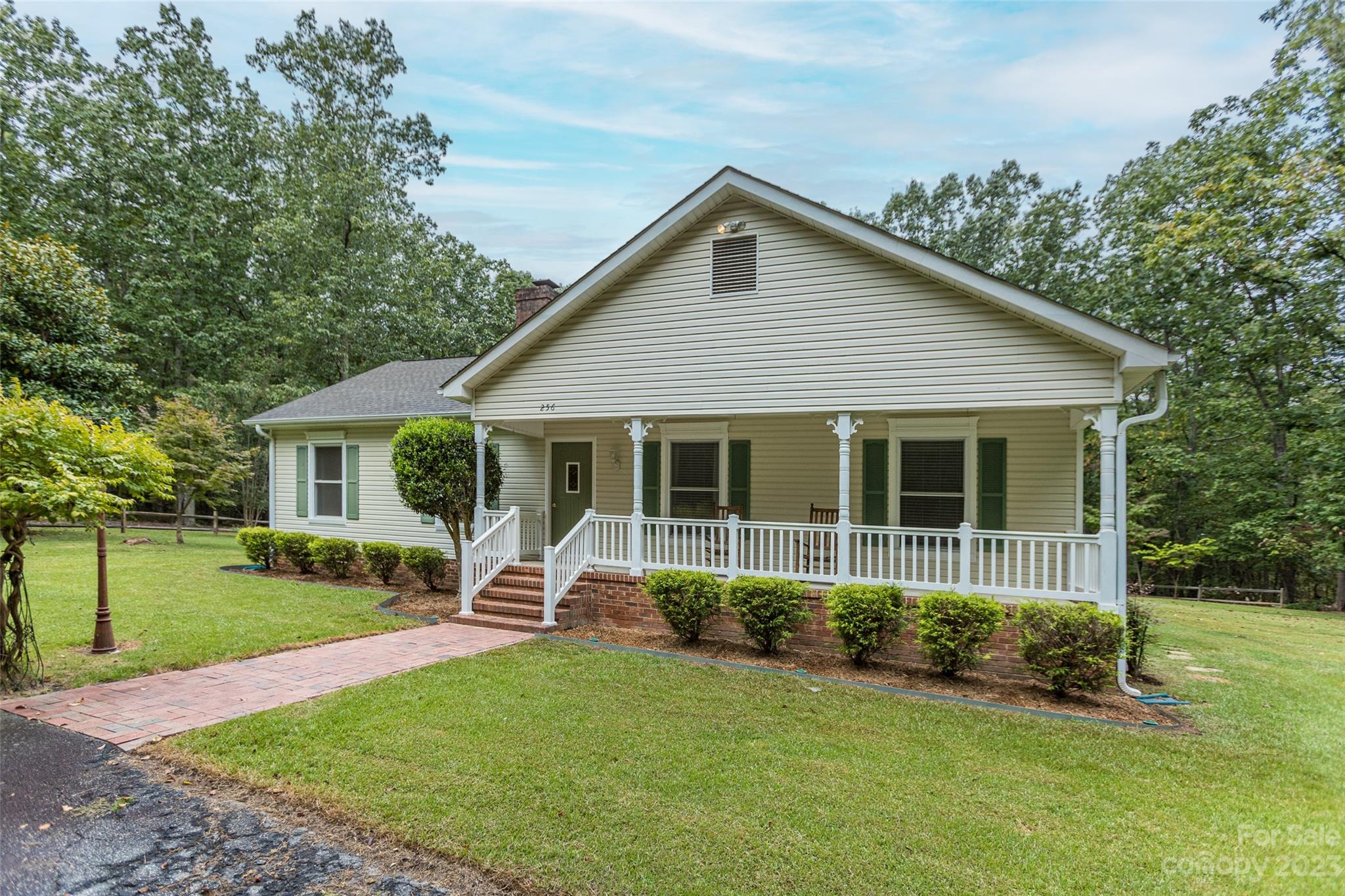 256 Georgewoods Drive Dallas, NC 28034 - Photo 4 of 45 a view of a house with a yard
