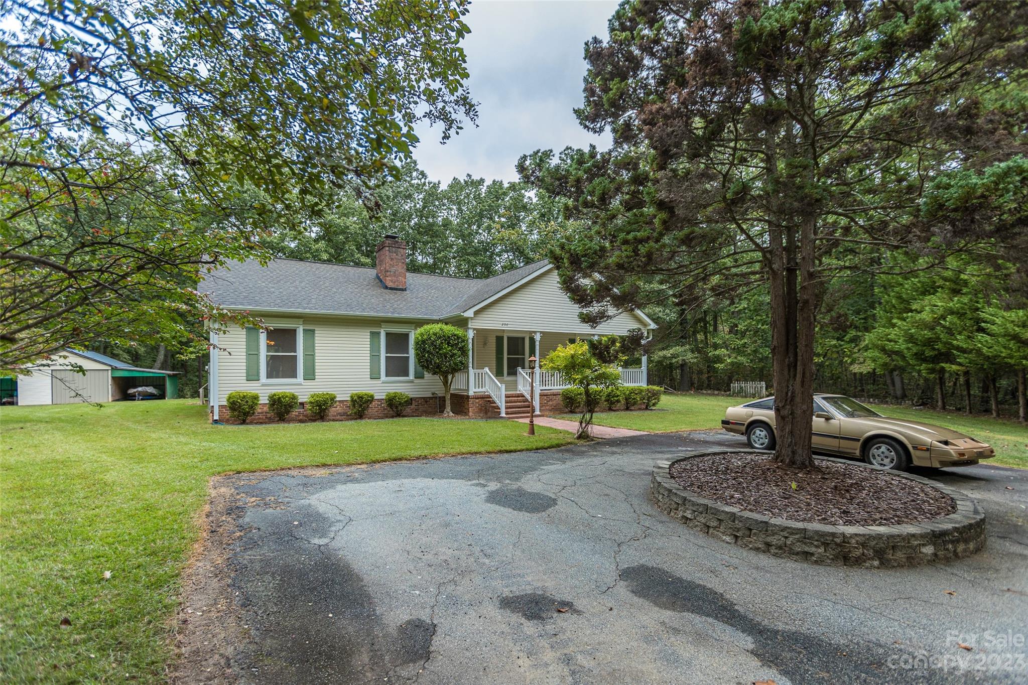 256 Georgewoods Drive Dallas, NC 28034 - Photo 41 of 45 a front view of a house with a yard and trees