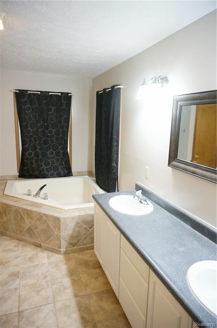 21020 Clark Road Belleville, MI 48111 - Photo 14 of 44 Master bathroom