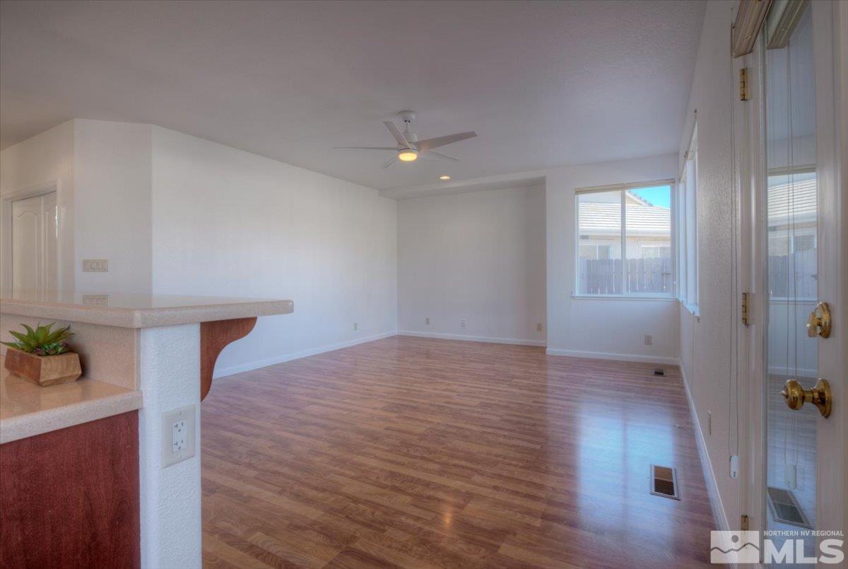 10016 Cascade Falls Drive Reno, NV 89521 - Photo 16 of 40 wooden floor in an empty room with a window