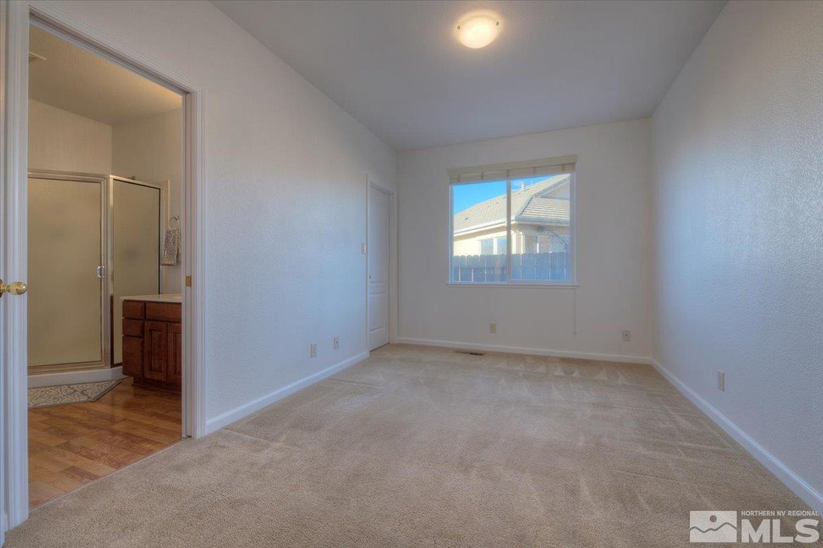 10016 Cascade Falls Drive Reno, NV 89521 - Photo 18 of 40 an empty room with windows and closet