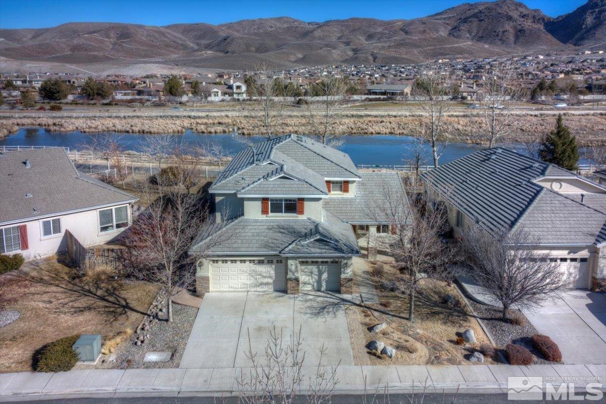 10016 Cascade Falls Drive Reno, NV 89521 - Photo 2 of 40 an aerial view of house with a garden