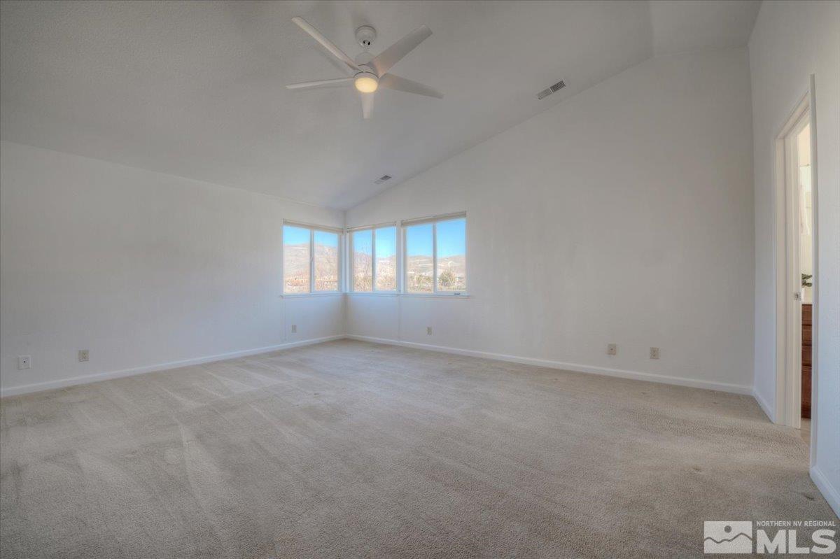 10016 Cascade Falls Drive Reno, NV 89521 - Photo 21 of 40 an empty room with a window and ceiling fan