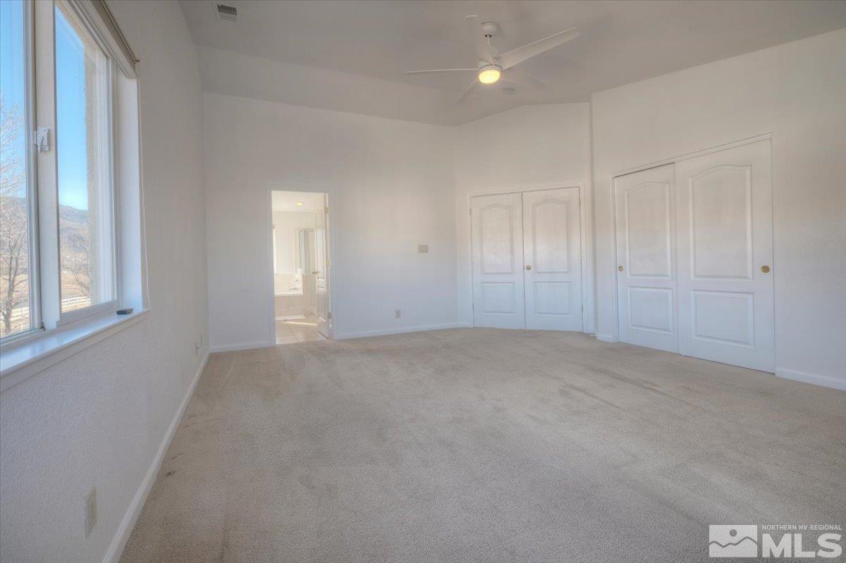 10016 Cascade Falls Drive Reno, NV 89521 - Photo 22 of 40 an empty room with windows and closet