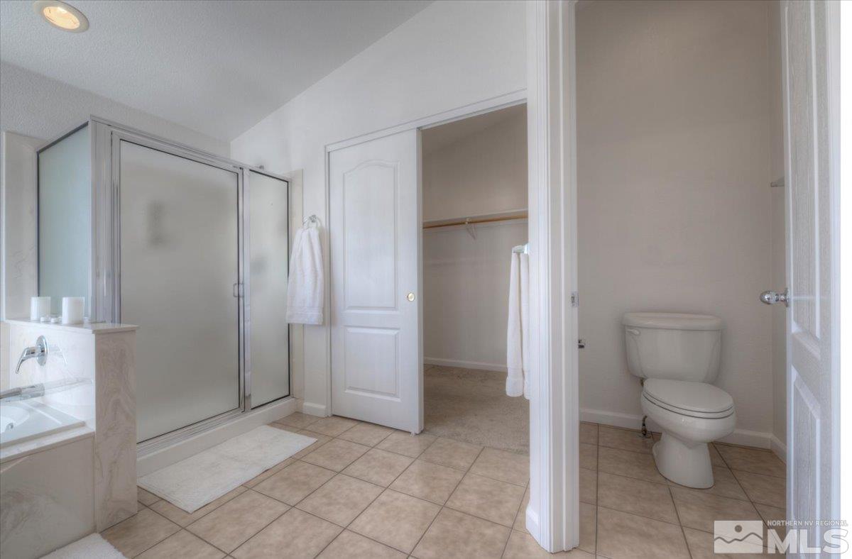 10016 Cascade Falls Drive Reno, NV 89521 - Photo 25 of 40 a bathroom with a toilet and a shower