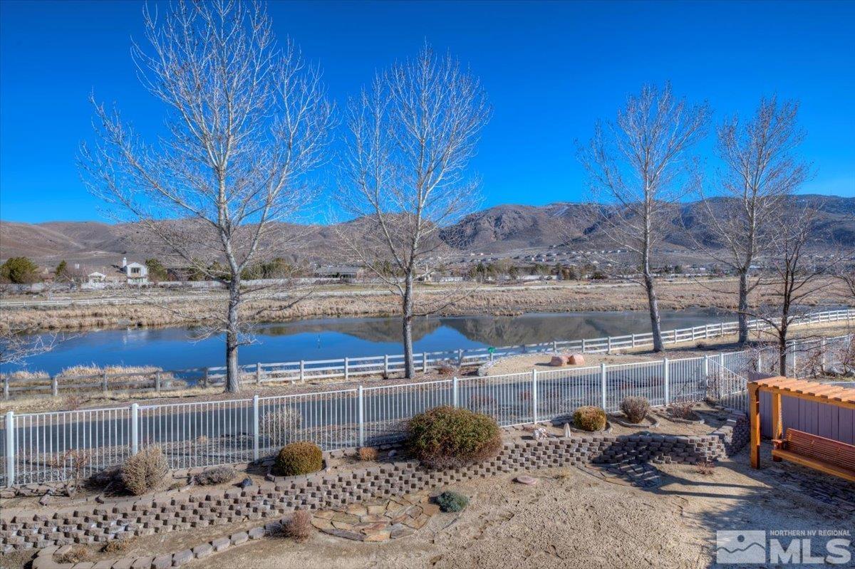 10016 Cascade Falls Drive Reno, NV 89521 - Photo 28 of 40 a view of roof deck with wooden fence and plants