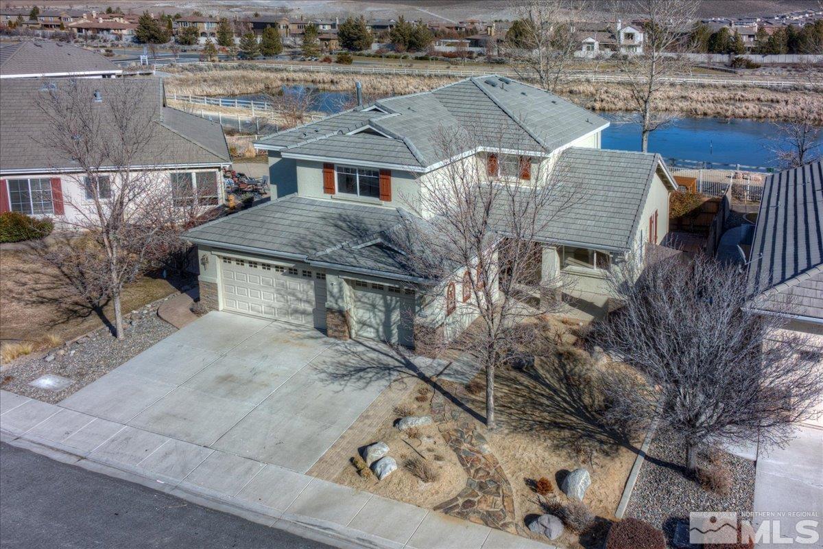 10016 Cascade Falls Drive Reno, NV 89521 - Photo 3 of 40 an aerial view of residential houses with outdoor space
