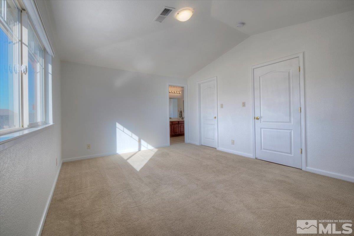 10016 Cascade Falls Drive Reno, NV 89521 - Photo 32 of 40 a view of an empty room with a window