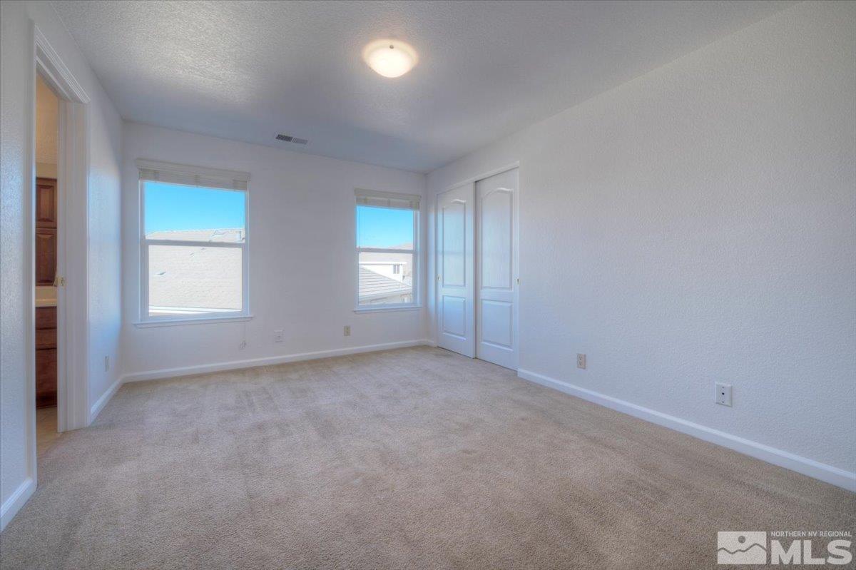 10016 Cascade Falls Drive Reno, NV 89521 - Photo 33 of 40 an empty room with windows