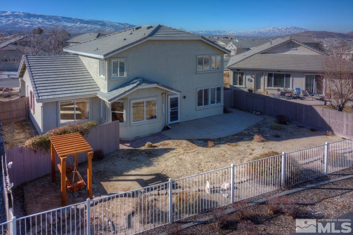 10016 Cascade Falls Drive Reno, NV 89521 - Photo 4 of 40 a front view of a house with a yard