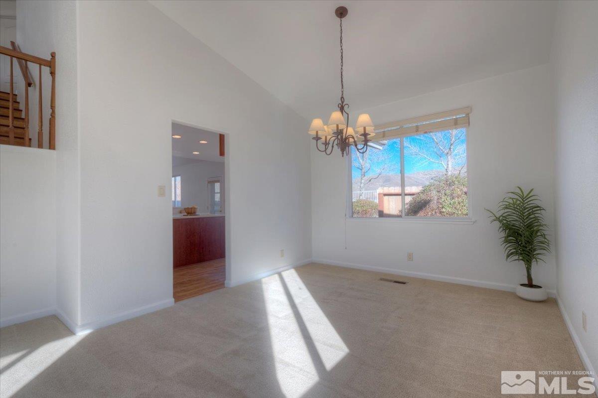 10016 Cascade Falls Drive Reno, NV 89521 - Photo 10 of 40 a view of a room with a chandelier and livingroom