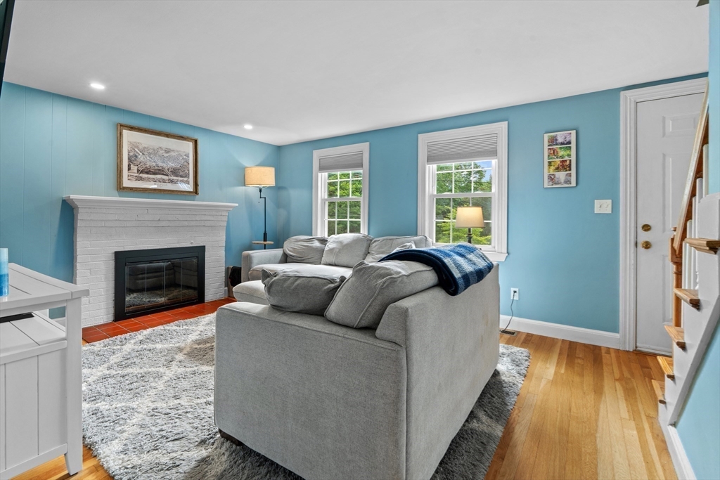 61 Broad Street Walpole, MA 02081 - Photo 11 of 37 a bedroom with a bed and a fireplace