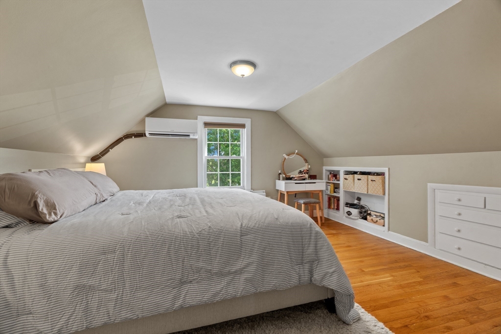 61 Broad Street Walpole, MA 02081 - Photo 16 of 37 a bedroom with a large bed and a closet