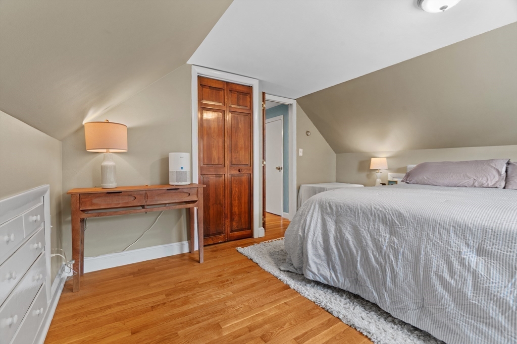 61 Broad Street Walpole, MA 02081 - Photo 17 of 37 a bedroom with a bed and a dresser