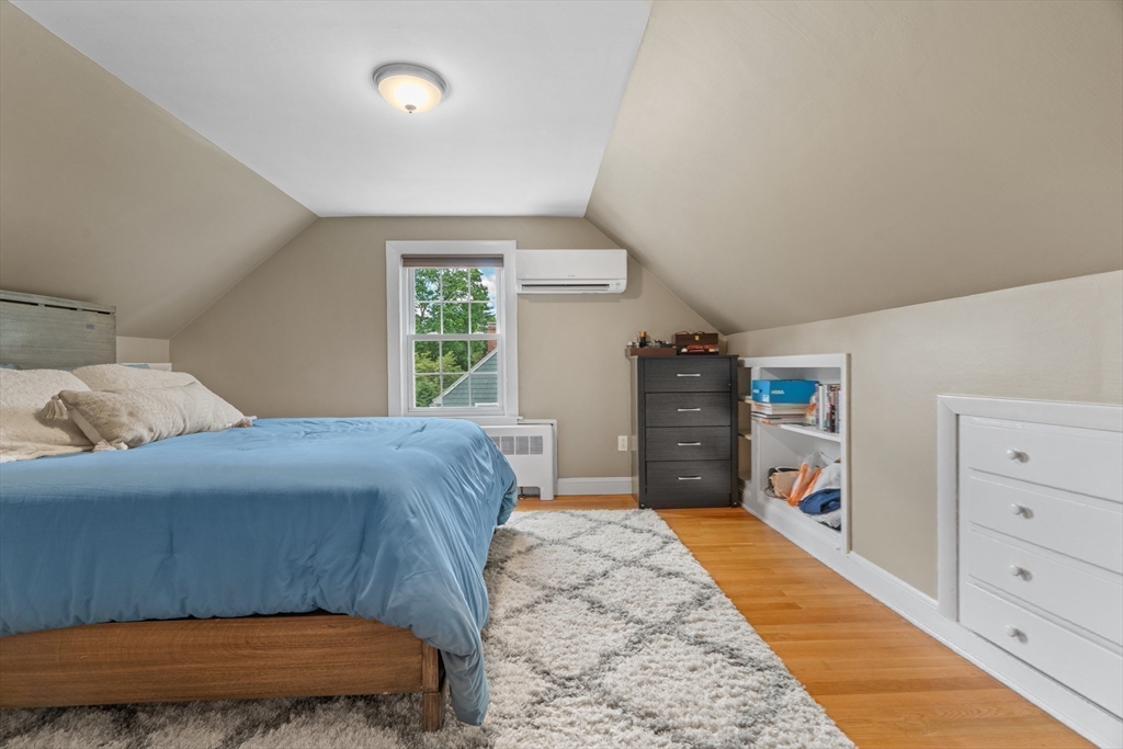 61 Broad Street Walpole, MA 02081 - Photo 18 of 37 a bedroom with a bed and cabinets