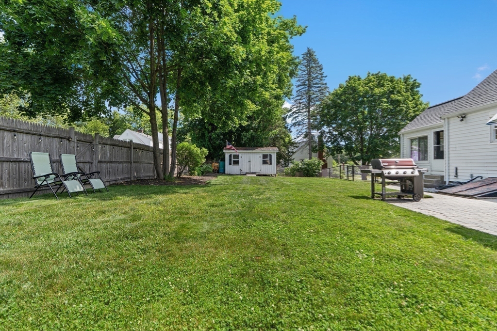 61 Broad Street Walpole, MA 02081 - Photo 25 of 37 a view of a backyard with a garden and entertaining space