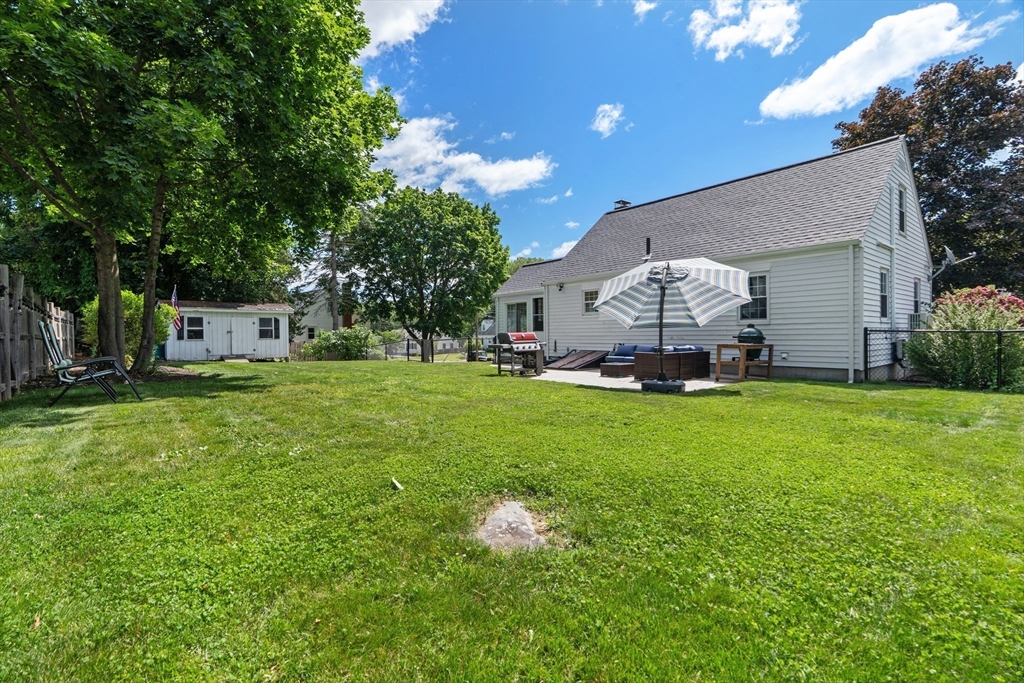 61 Broad Street Walpole, MA 02081 - Photo 3 of 37 a front view of a house with garden