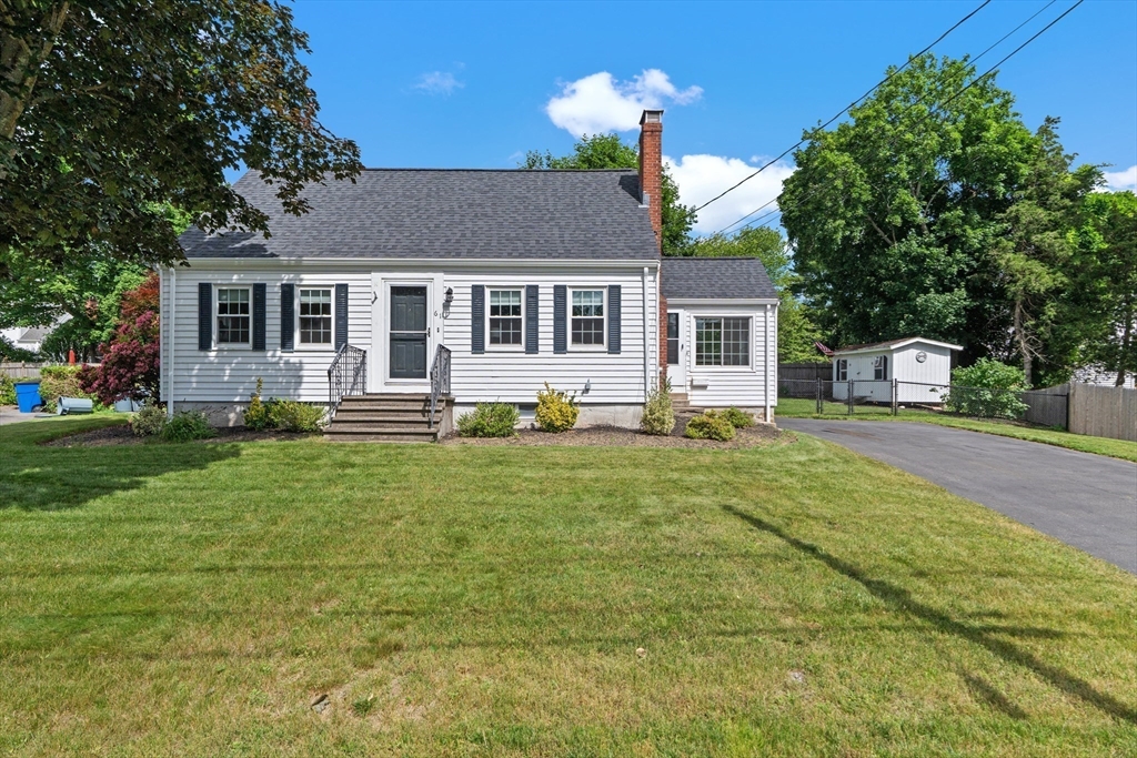 61 Broad Street Walpole, MA 02081 - Photo 31 of 37 a front view of house with yard and green space