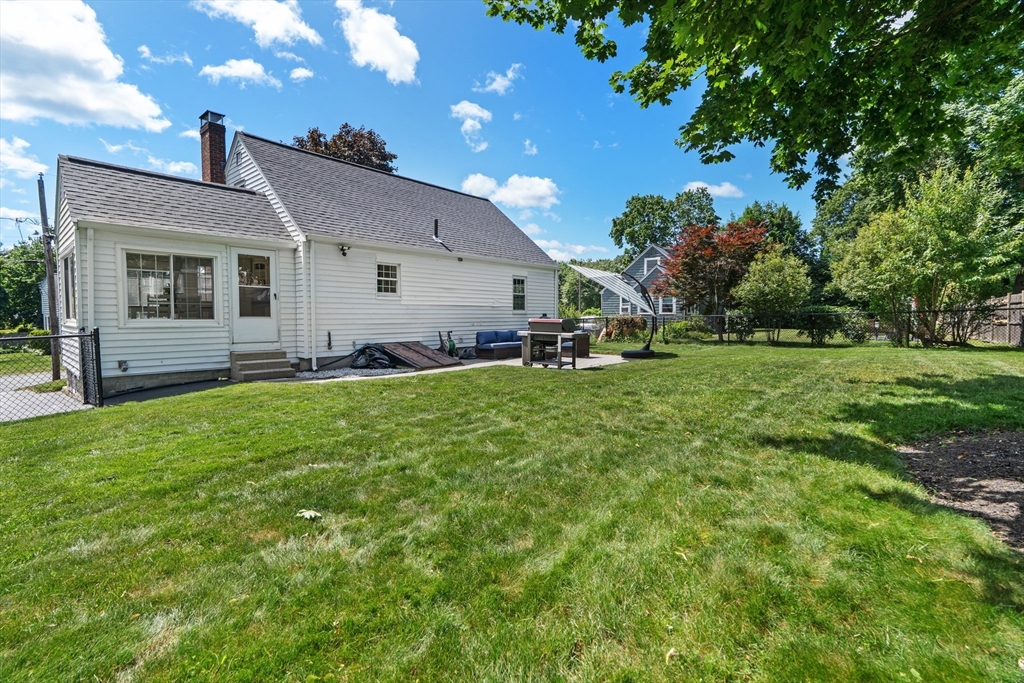 61 Broad Street Walpole, MA 02081 - Photo 34 of 37 a front view of house with yard and green space