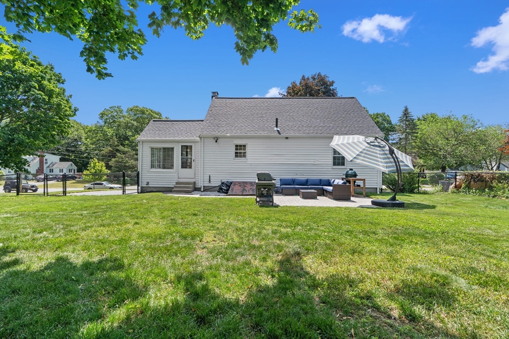 61 Broad Street Walpole, MA 02081 - Photo 35 of 37 a front view of a house with a garden