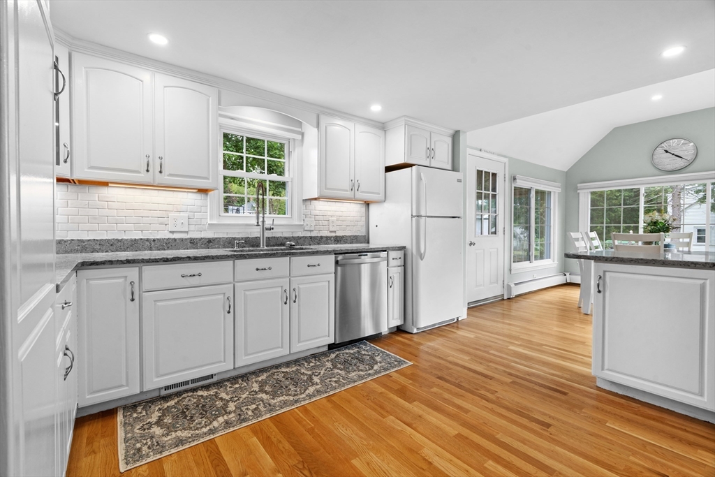 61 Broad Street Walpole, MA 02081 - Photo 5 of 37 a kitchen with stainless steel appliances granite countertop a refrigerator sink and white cabinets