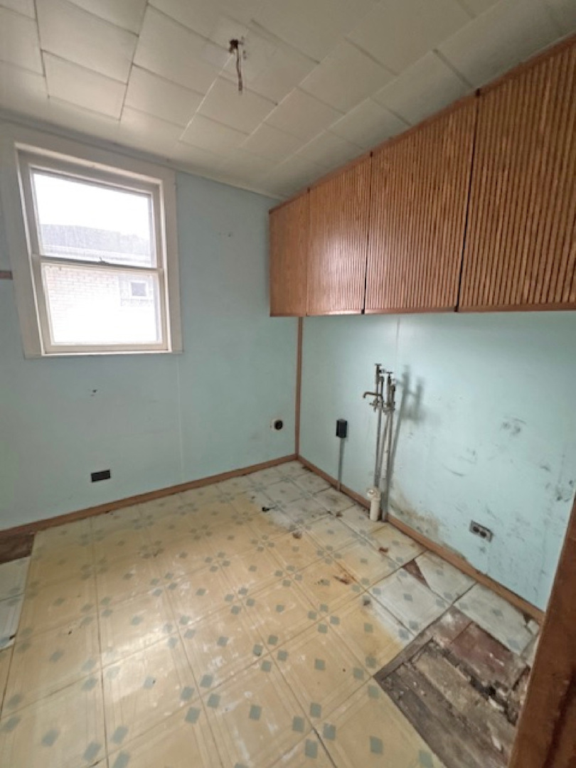 2024 Union Street Blue Island, IL 60406 - Photo 14 of 27 a room with a wooden bed furniture and a window