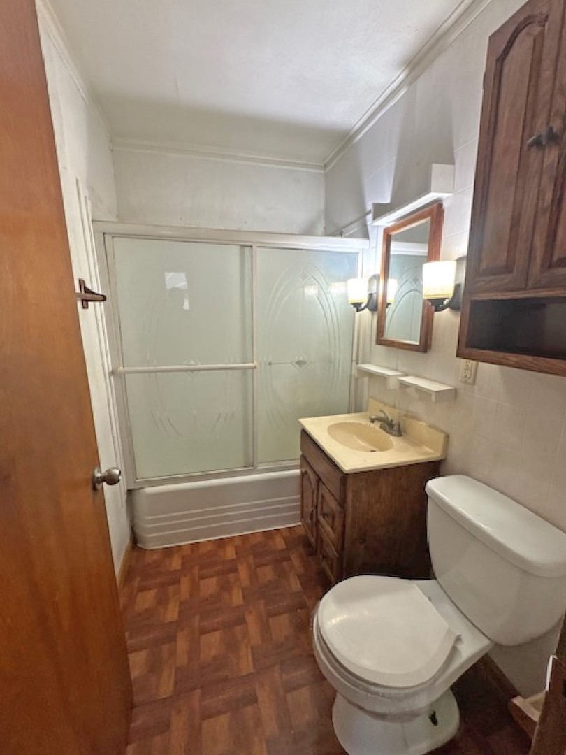 2024 Union Street Blue Island, IL 60406 - Photo 15 of 27 a bathroom with a toilet sink and shower