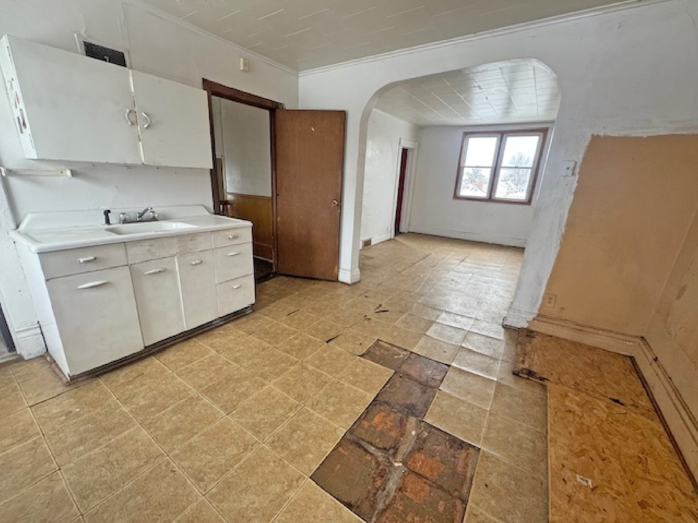 2024 Union Street Blue Island, IL 60406 - Photo 22 of 27 a kitchen with cabinets and window