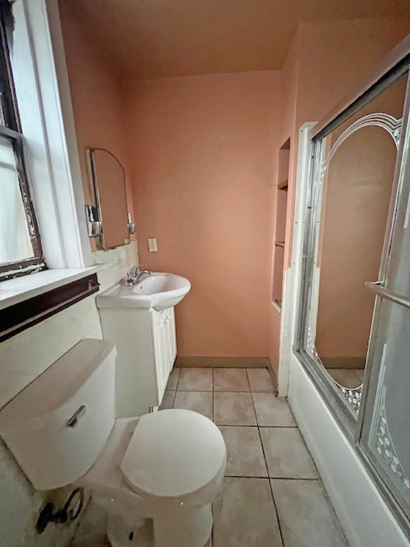 2024 Union Street Blue Island, IL 60406 - Photo 23 of 27 a bathroom with a sink and a mirror